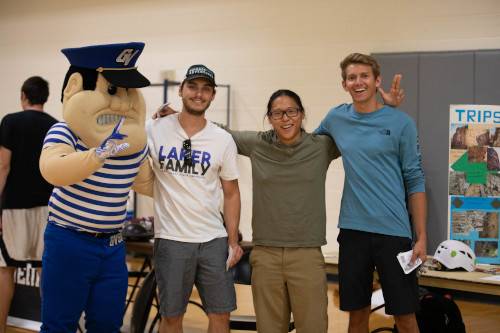 Louis the Laker with students